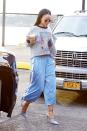 <p>Rihanna fully revived '90s sport style on Friday when she stepped out in NYC wearing a cropped graphic sweatshirt with light blue snap-side track pants by Maison Margiela. </p>