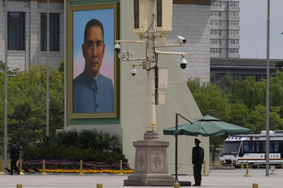 A paramilitary police officer stands guard near a portrait of Sun Yat-sen, who is widely regarded as the founding father of modern China, on Tiananmen Square on Thursday, April 28, 2022, in Beijing. With the May Day holidays just around the corner, Beijing has been tightening COVID-19 restrictions as it seeks to prevent a wider outbreak. (AP Photo/Ng Han Guan)