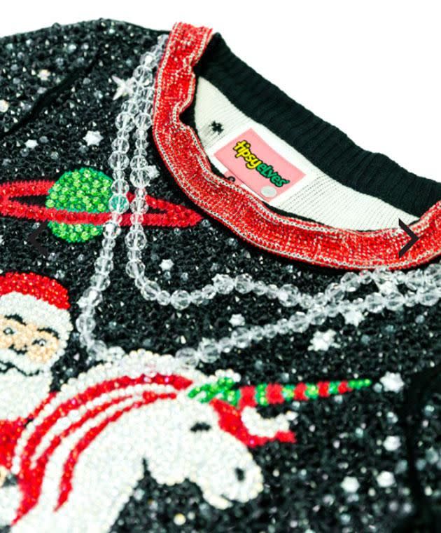 In case you missed it, the jumper features an oversized Swarovski necklace. Photo: www.tipsyelves.com/