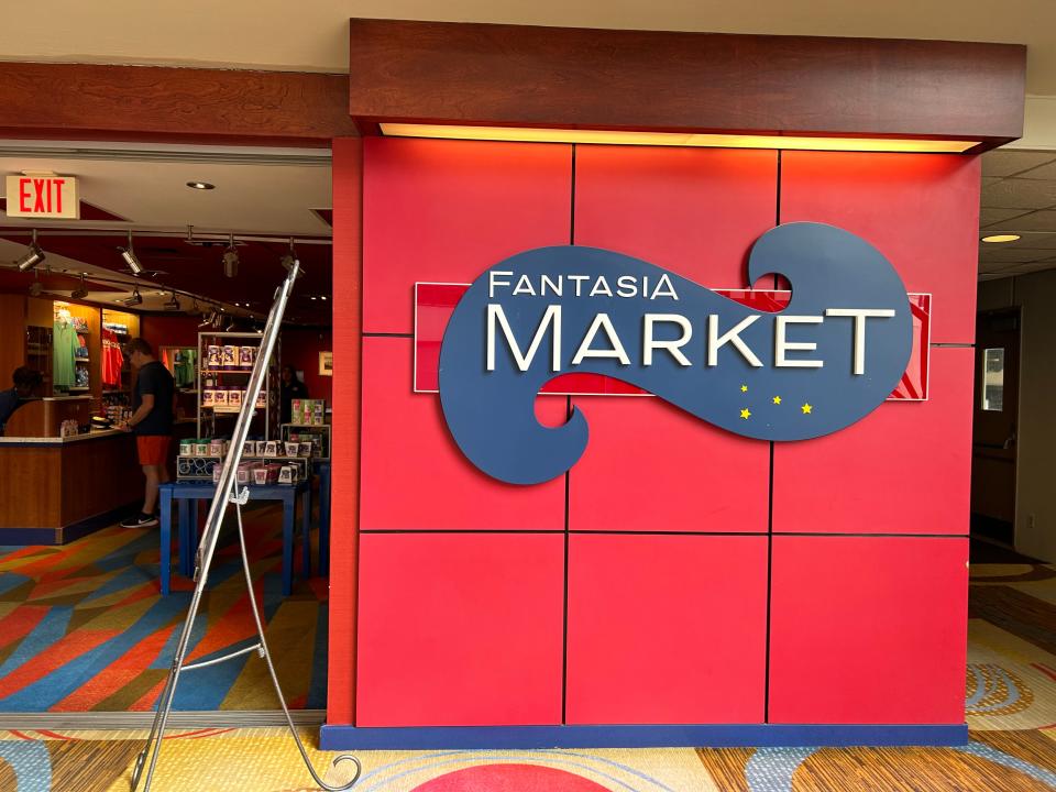 red wall with blue fantasia market sign