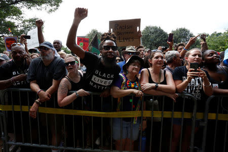 Counter-protesters shout at members of the Ku Klux Klan, who are rallying in opposition to city proposals to remove or make changes to Confederate monuments, in Charlottesville, Virginia, U.S. July 8, 2017. REUTERS/Jonathan Ernst