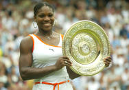 Serena Williams lifts the trophy after winning against sister Venus. (Photo by Mike Egerton/EMPICS via Getty Images)