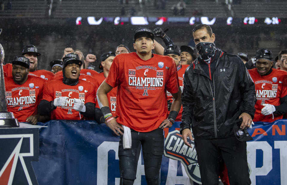 Desmond Ridder and head coach Luke Fickell of the Cincinnati Bearcats look on after winning the American Athletic Conference championship on Dec. 19. (Benjamin Solomon/Getty Images)