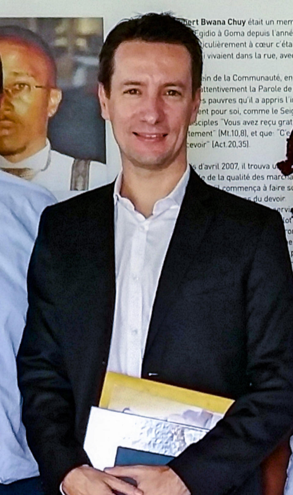 The Italian ambassador to Congo, Luca Attanasio, poses for a photo during a visit to the Sant'Egidio Community Dream center in Kinshasa, Congo, on Jan. 24, 2018. The Italian ambassador to Congo, Italian Carabinieri officer Vittorio Iacovacci, and their Congolese driver were killed Monday in an attack on a U.N. convoy in an area that is home to myriad rebel groups, the Foreign Ministry, and local people said. (Comunita' di Sant'Egidio via AP)