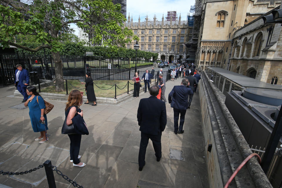 MPs lining up to vote in the Commons (Jonathan Brady/PA)