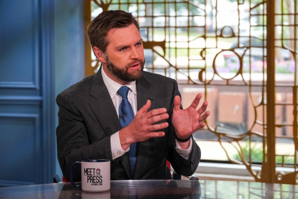 A picture of Senator J.D. Vance behind a desk on a news show