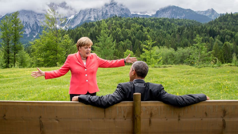 German Chancellor Angela Merkel chats with a relaxed US President Barack Obama outside during the 2015 G7 summit in southern Germany. - Michael Kappeler/AFP/Getty Images