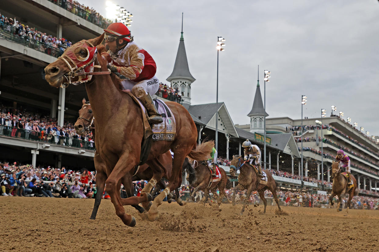 LOUISVILLE, KY - MAY 07: Jockey Sonny Leon aboard Rich Strike (21) wins the148th running of the Kentucky Derby at Churchill Downs in Louisville, Kentucky. (Photo by Brian Spurlock/Icon Sportswire via Getty Images)