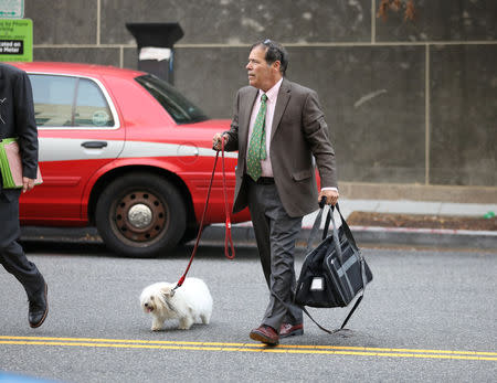 Randy Credico, an associate of former Trump campaign adviser Roger Stone, walks with his pet dog as he arrives to testify before the grand jury convened by Special Counsel Robert Mueller at U.S. District in Washington, U.S., September 7, 2018. REUTERS/Chris Wattie