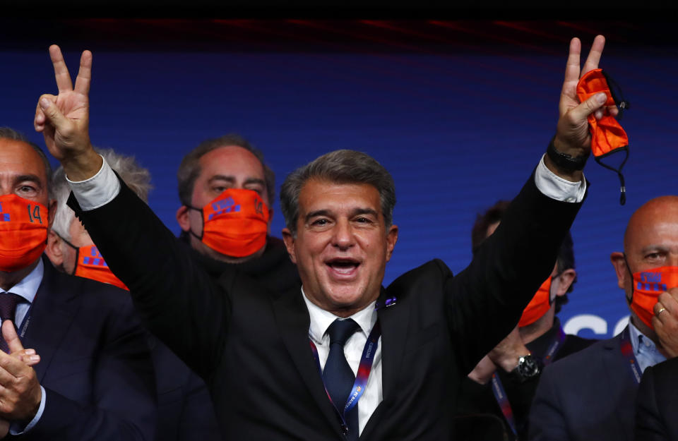 FILE - Joan Laporta celebrates his victory after elections at the Camp Nou stadium in Barcelona, Spain, Sunday, March 7, 2021. The European Union’s top court has ruled UEFA and FIFA acted contrary to EU competition law by blocking plans for the breakaway Super League. The case was heard last year at the Court of Justice after Super League failed at launch in April 2021. UEFA President Aleksander Ceferin called the club leaders “snakes” and “liars.” (AP Photo/Joan Monfort, File)
