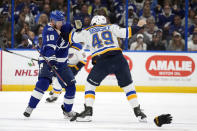 St. Louis Blues center Ivan Barbashev (49) and Tampa Bay Lightning right wing Corey Perry (10) fight during the first period of an NHL hockey game Friday, Nov. 25, 2022, in Tampa, Fla. (AP Photo/Chris O'Meara)