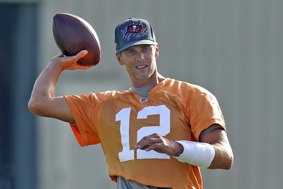 Tampa Bay Buccaneers quarterback Tom Brady throws a pass during NFL football training camp, Thursday, July 28, 2022, in Tampa, Fla. (AP Photo/Chris O'Meara)