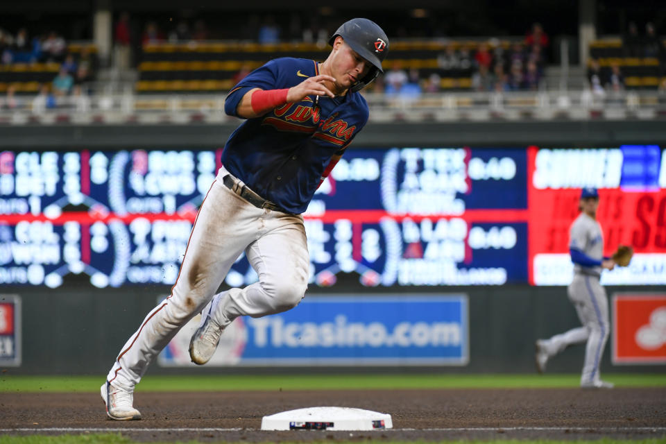 Minnesota Twins' Jose Miranda rounds third base as he heads home to score on a single by Gilberto Celestino off Kansas City Royals pitcher Daniel Lynch during the fourth inning of a baseball game Thursday, May 26, 2022, in Minneapolis. (AP Photo/Craig Lassig)