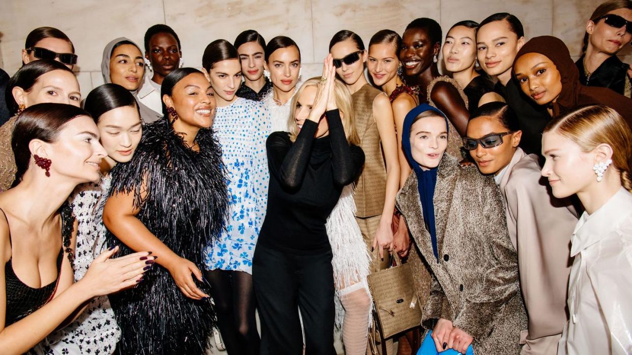 tory burch with models at her fall 2024 show