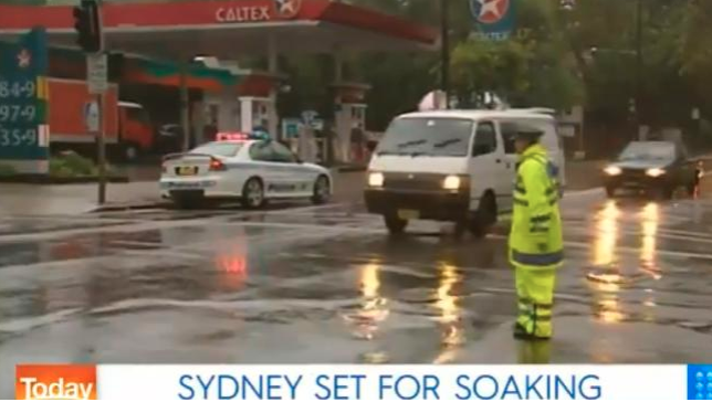 Sydney in 2004 with a police man directing traffic in the rain