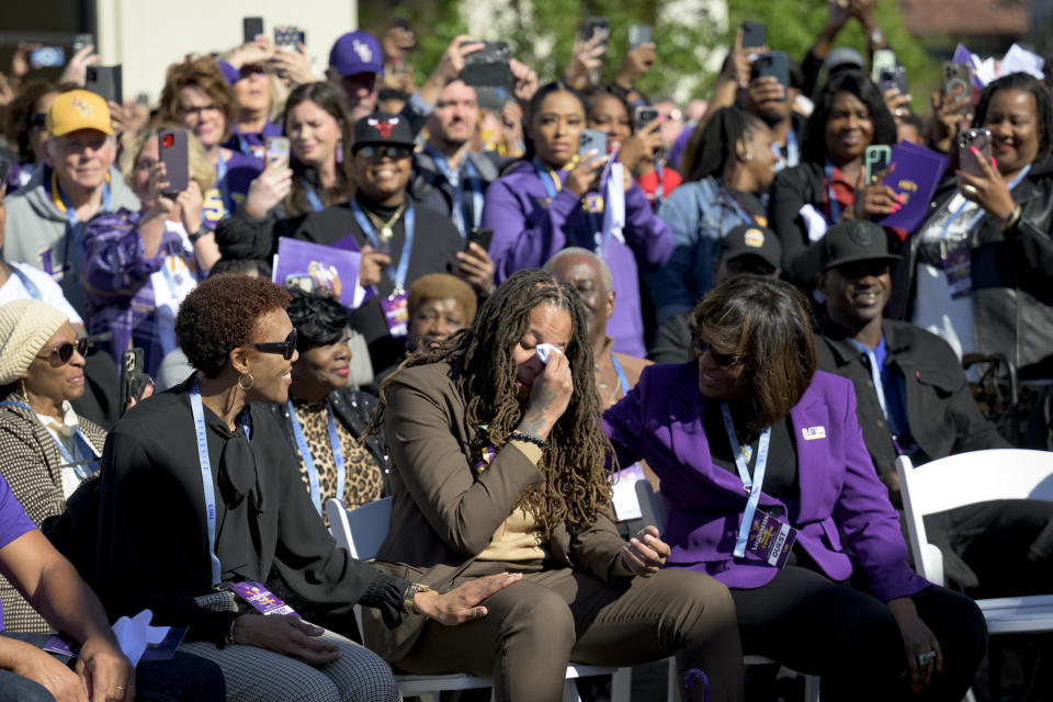 Seimone Augustus, a former LSU player who lead her team to multiple final fours and a Minnesota Lynx player who won four WNBA Championships, cries before her statue unveiling at the LSU campus on Sunday, Jan. 15, 2023, in Baton Rouge, La. (AP Photo/Matthew Hinton)