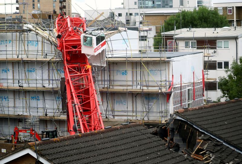 A collapsed crane is seen at a construction site in Bow, east London