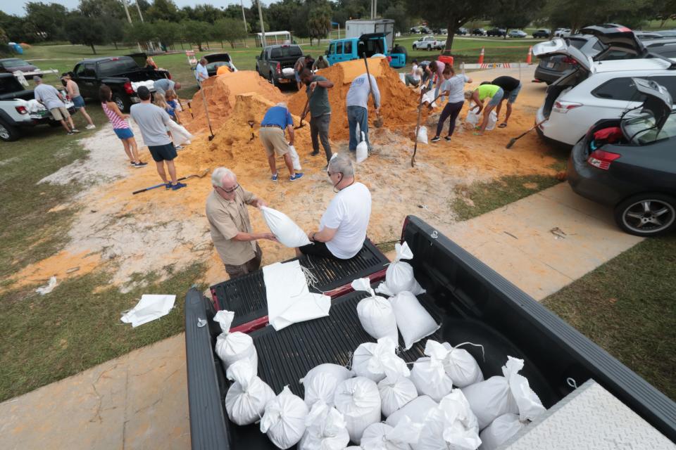 Residents load up on sandbags at Nova Community Center in Ormond Beach on Tuesday, Sept. 27, 2022.