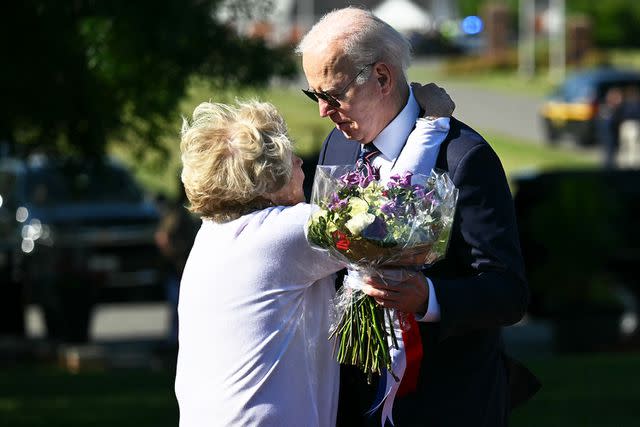 <p>Mandel Ngan/AFP/Getty</p> Former Delaware state Sen. Nancy Cook embraces President Joe Biden on May 30, 2024, at the Veterans Memorial Park in New Castle, Del.