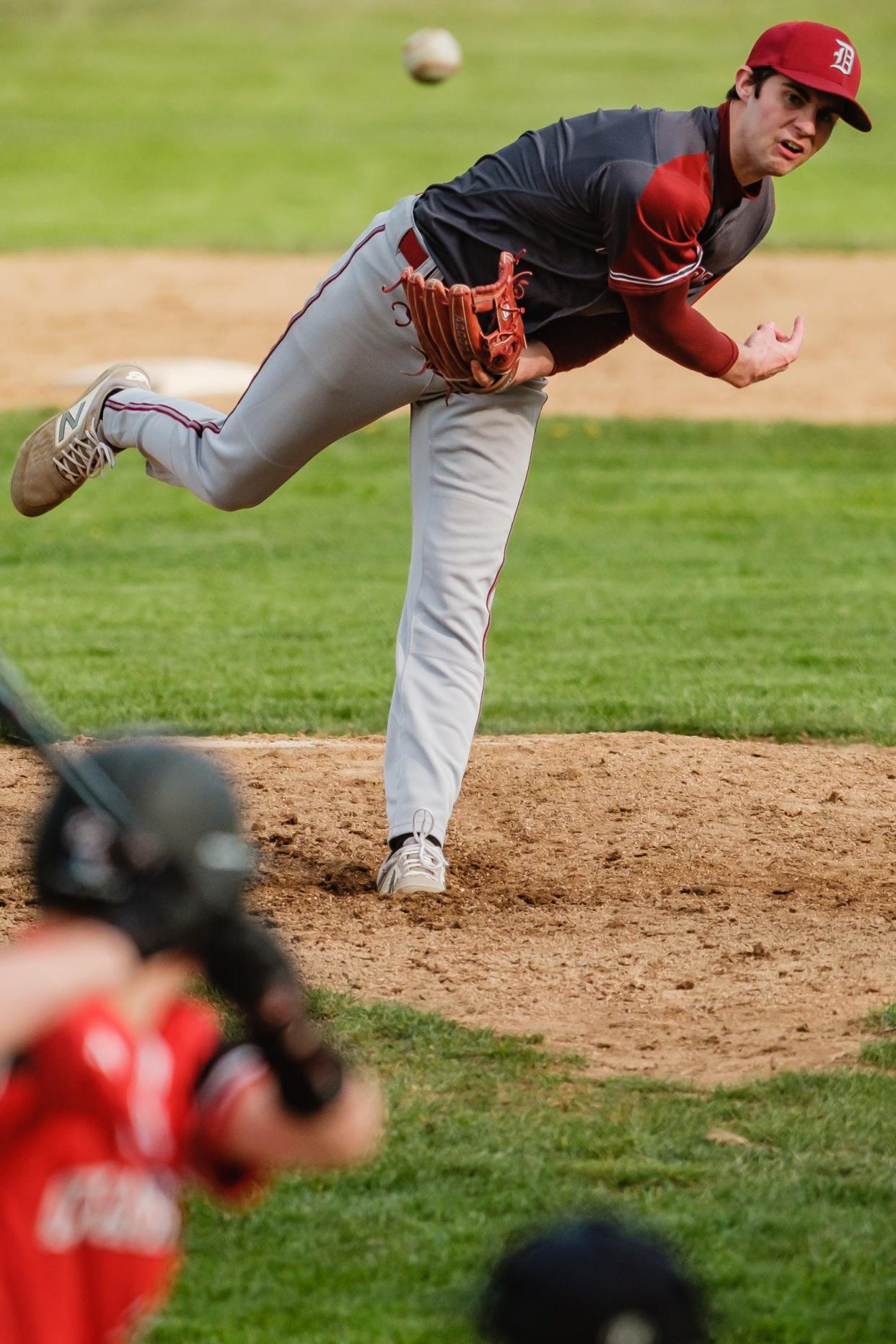 Dover's Ayden Hall makes a delivery to New Philadelphia Friday night.