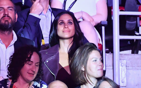 Markle watches Harry deliver his speech at the opening ceremony - Credit: Wireimage