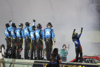 William Byron, right, celebrates with his crew after winning a NASCAR Cup Series auto race, Sunday, Feb. 28, 2021, in Homestead, Fla. (AP Photo/Wilfredo Lee)