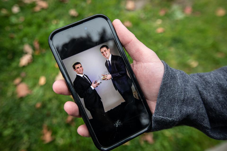 Marty Levine, 21, a Cornell University senior from Suffern, N.Y. holds his phone showing a photo of him with his friend, Omer Neutra, an Israeli Defense Force soldier currently being held hostage by Hamas. Levine, photographed Nov. 6, 2023, and Neutra, originally from Plainview, Long Island, met in a Jewish youth group in 2017.