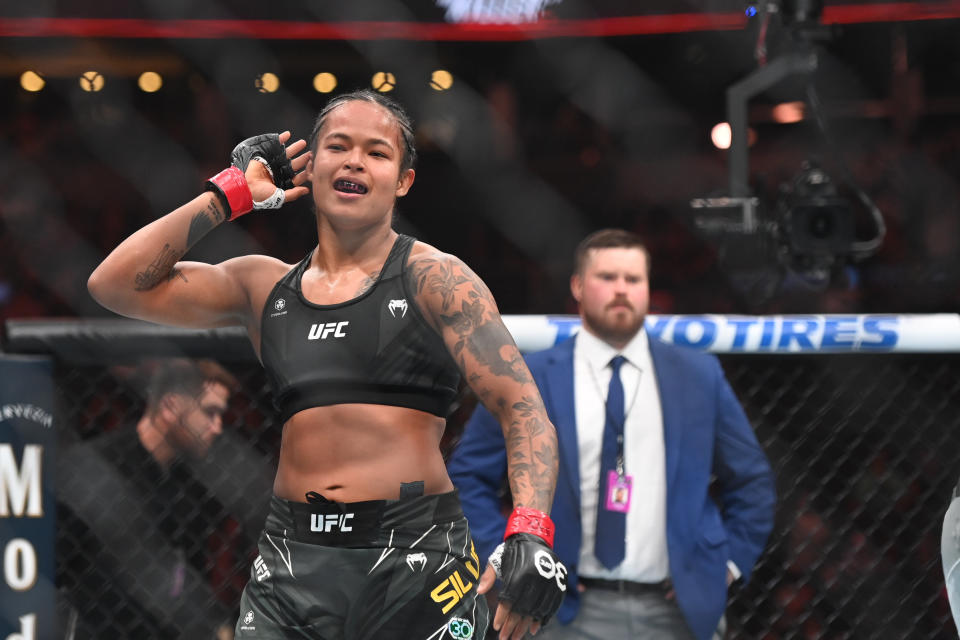 Aug 19, 2023; Boston, MA, USA; Karine Silva (red gloves) reacts to defeating Marina Moroz (blue gloves) during UFC 292 at TD Garden. Mandatory Credit: Bob DeChiara-USA TODAY Sports