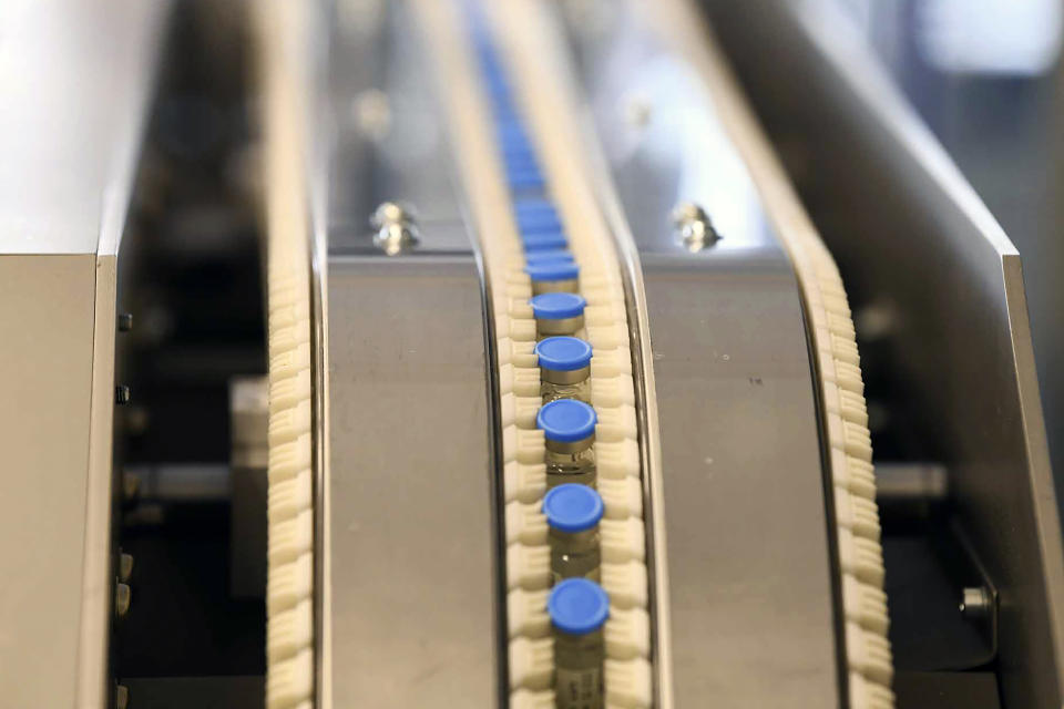 FILE - Vials of the Johnson & Johnson vaccine move along a conveyor belt at ASPEN Pharmaceuticals in Port Elizabeth, South Africa March 29, 2021. The first factory to produce COVID-19 vaccines in Africa has announced on Thursday, May 12, 2022 that it has not received adequate orders and is planning to stop production within a few weeks, in what a senior World Health Organization official described as a "failure" in efforts to achieve vaccine equity. (AP Photo/File)