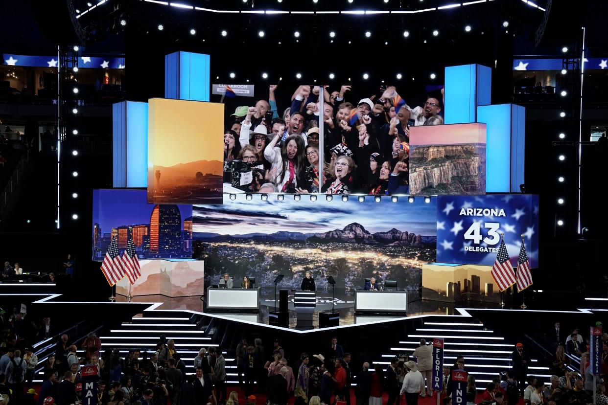 The Arizona delegation celebrates as their votes are cast during the first day of the Republican National Convention. The RNC kicked off the first day of the convention with the roll call vote of the states.