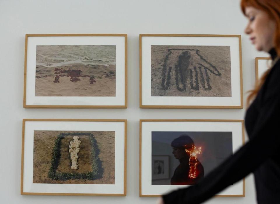 Melissa Wallen, the director of the de la Cruz Collection, walks past works by Ana Mendieta that are on display on Monday, April 8, 2024, in Miami, Florida. Christies’s will begin selling works from De la Cruz’s collection in May.