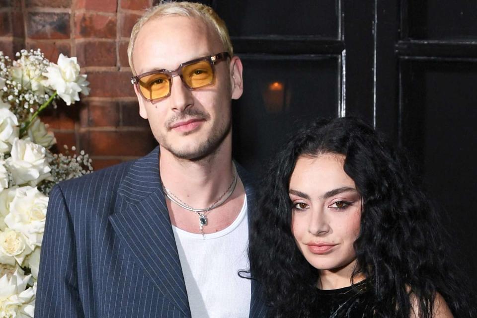 <p>David M. Benett/Jed Cullen/Dave Benett/Getty</p> George Daniel and Charli XCX in London in May 2023