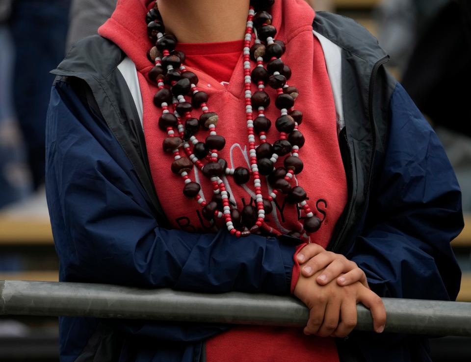 Oct. 14, 2023; Lafayette, In., USA; 
An Ohio State football fan wears buckeye necklaces during the first half of Saturday's NCAA Division I football game against the Purdue Boilermakers at Ross-Ade Stadium in Lafayette.