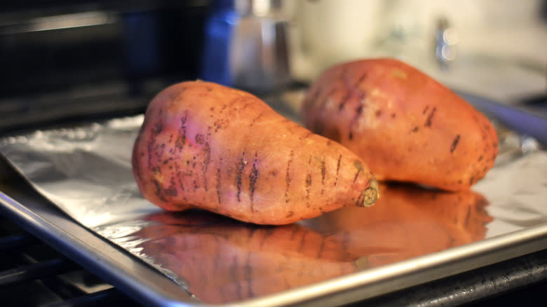 sweet potatoes on baking sheet