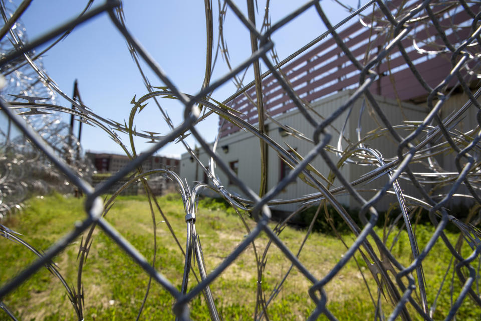 The Rikers Island jail complex with razor wire fencing is shown in the Bronx borough of New York, on Tuesday, May 7, 2024. (AP Photo/Ted Shaffrey)