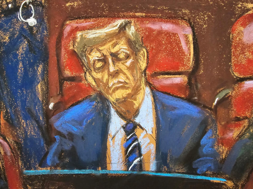 Trump sits with his eyes closed at the defense table during jury selection in this courtroom sketch.