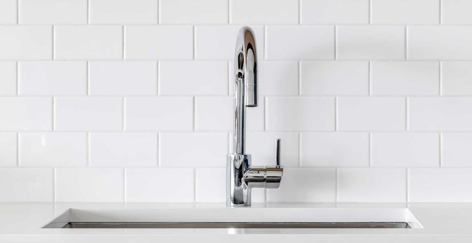 White kitchen with white metro tile splashback is considered a kitchen trend to avoid in 2023