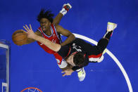 Philadelphia 76ers' Tyrese Maxey, left, tries to get a shot past Portland Trail Blazers' Jusuf Nurkic during the first half of an NBA basketball game, Monday, Nov. 1, 2021, in Philadelphia. (AP Photo/Matt Slocum)