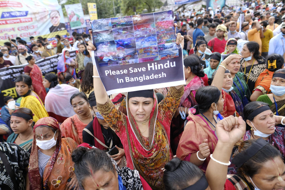 Hundreds of Hindus protesting against attacks on temples and the killing of two Hindu devotees in another district shout slogans in Dhaka, Bangladesh, Monday, Oct.18, 2021. A viral social media image perceived as insulting to the country's Muslim majority last week triggered protests and incidents of vandalism at Hindu temples across Bangladesh. About 9% of Bangladesh’s 160 million are Hindus. (AP Photo/Mahmud Hossain Opu)