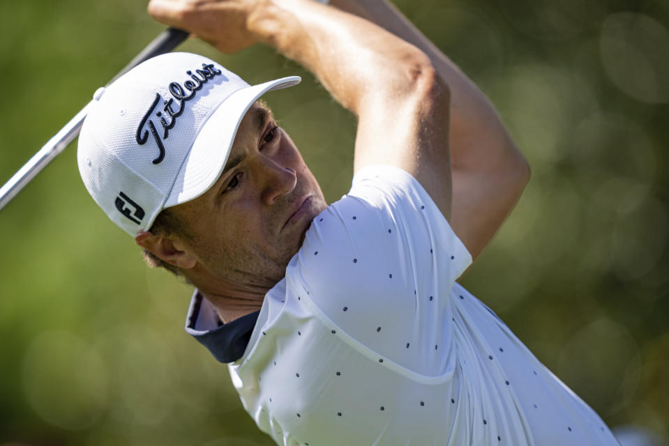 Justin Thomas watches his tee shot on the 3rd hole during the first round of the Wells Fargo Championship golf tournament at Quail Hollow Club on Thursday, May 6, 2021, in Charlotte, N.C. (AP Photo/Jacob Kupferman)