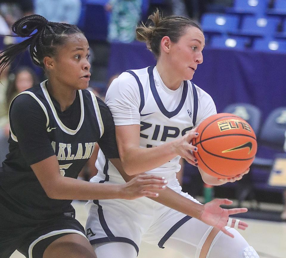 Oakland's Brooke Quarles-Daniels looks to steal the ball from University of Akron guard Morgan Haney on Monday in Akron.