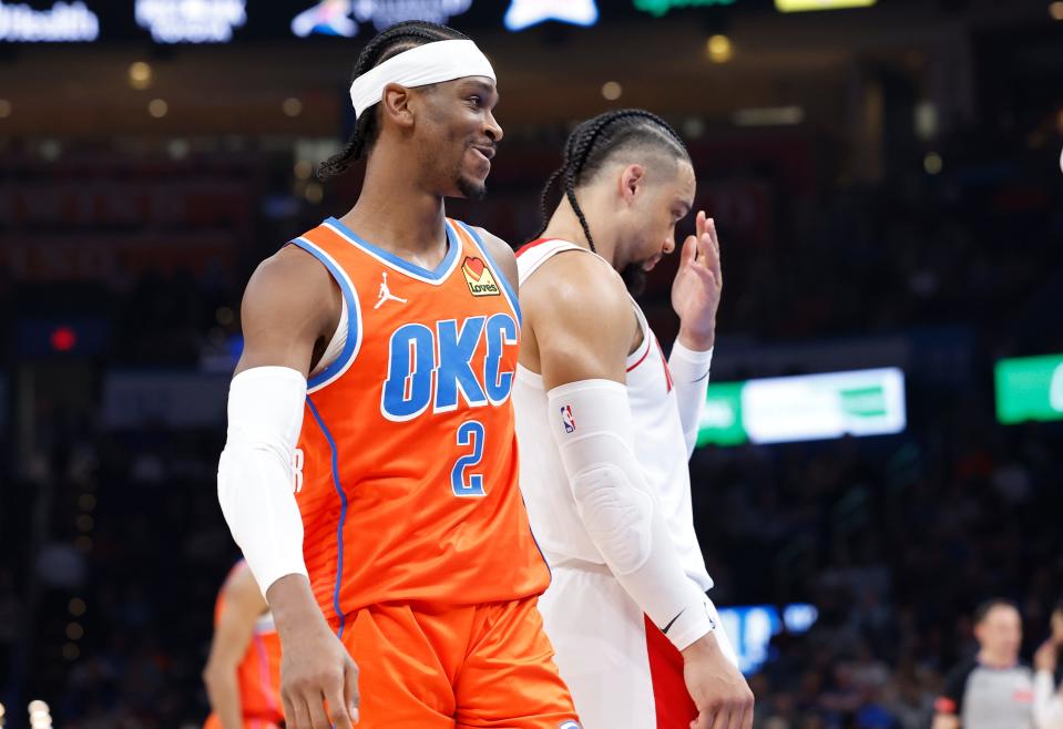 Thunder guard Shai Gilgeous-Alexander (2) smiles after a play against the Rockets during the second quarter Tuesday night.