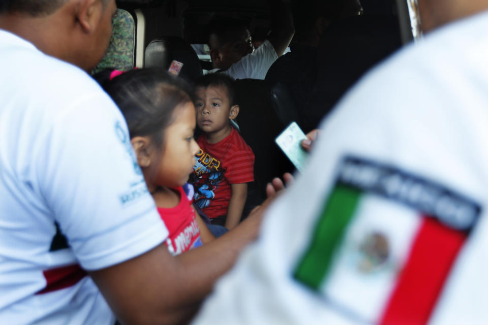 Mexican migration officials check the identification cards of people traveling in public transportation at a checkpoint in Tapachula, Chiapas state, Mexico, Sunday, June 9, 2019. Mexican and U.S. officials reached an accord late Friday that calls on Mexico to crackdown on migrants in exchange for Trump backing off his threat to impose a 5% tariff on Mexico’s exports if it did not stem the flow of Central American migrants crossing its territory toward the U.S. (AP Photo/Marco Ugarte)