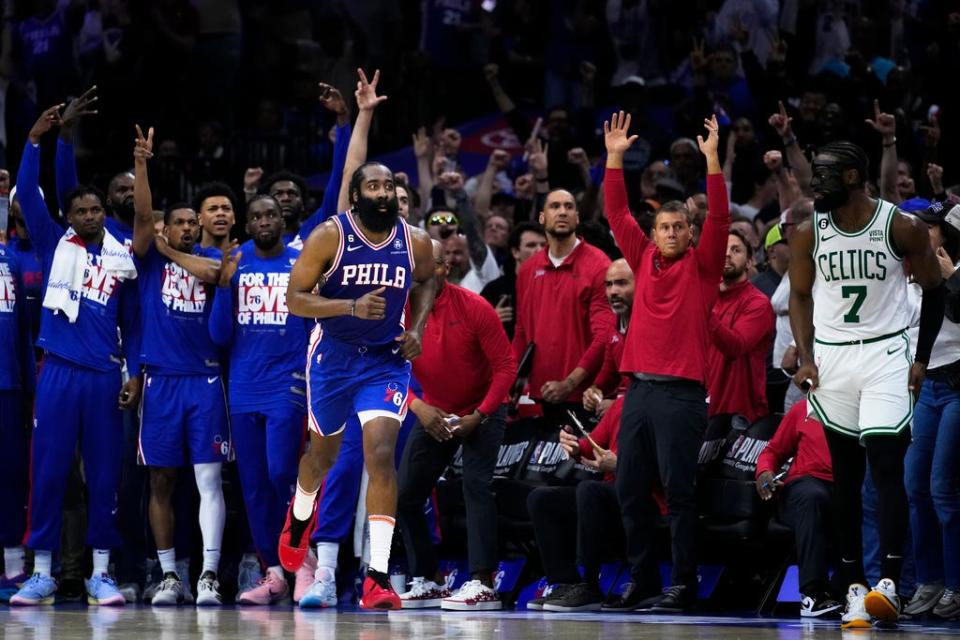 Philadelphia 76ers' James Harden, center front, reacts after scoring past Boston Celtics' Jaylen Brown (7) during overtime of Game 4 in an NBA basketball Eastern Conference semifinals playoff series, Sunday, May 7, 2023, in Philadelphia. (AP Photo/Matt Slocum)