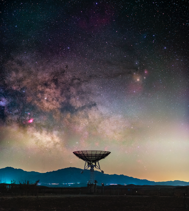 <p>The Milky Way rises ominously above a small radio telescope from a large array at Miyun Station, National Astronomical Observatory of China. (Pic: Haitong Yu) </p>