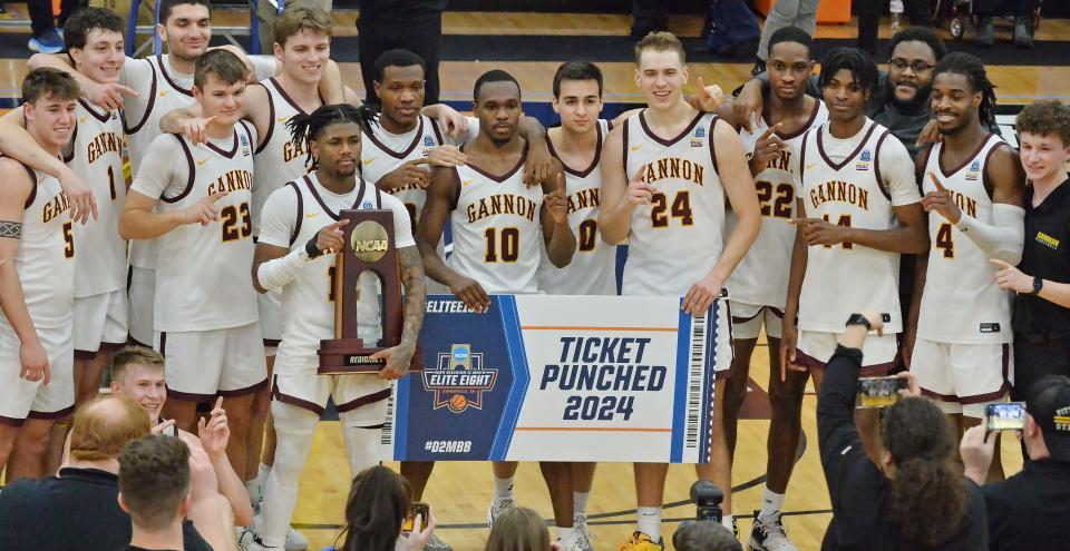 Gannon University teammates celebrate a last-second win over the University of Charleston in the NCAA Division II Atlantic Regional men's basketball championship game inside the Joann Mullen Gymnasium, Hagerty Family Events Center, in Erie on March 19, 2024.
