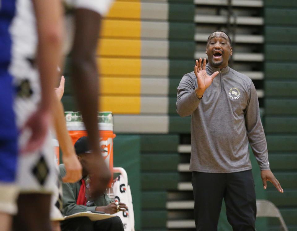 Rush-Henrietta coach Calvin Betts has returned to his alma mater to begin his varsity boys basketball coaching career.