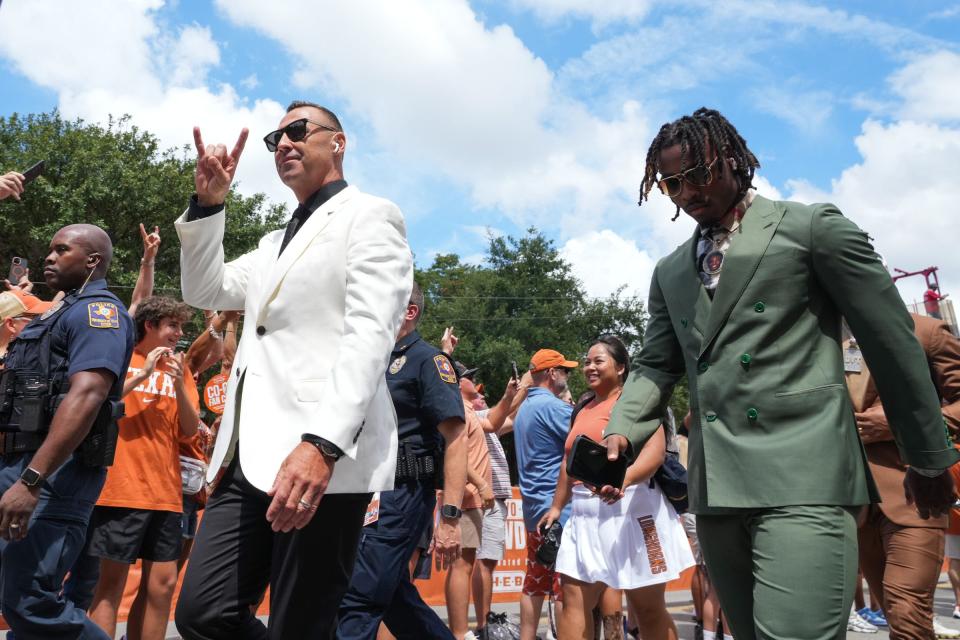 Head coach Steve Sarkisian and team members greet fans before the Texas Longhorns take on Colorado State at Darrell K Royal-Texas Memorial Stadium in Austin Saturday, Aug. 31, 2024.