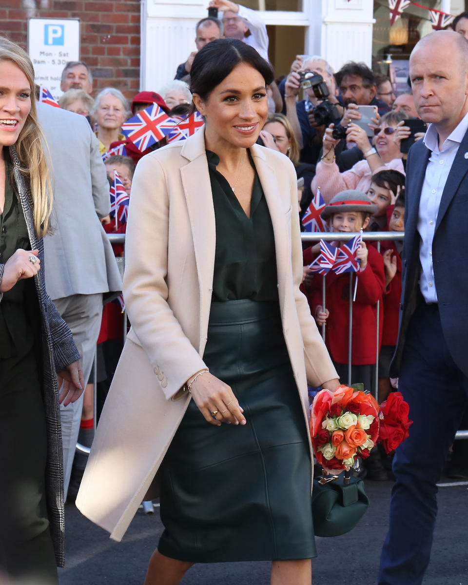 Meghan Markle wore a Hugo Boss leather pencil skirt for her trip to Sussex. (Photo: Neil Mockford/GC Images)