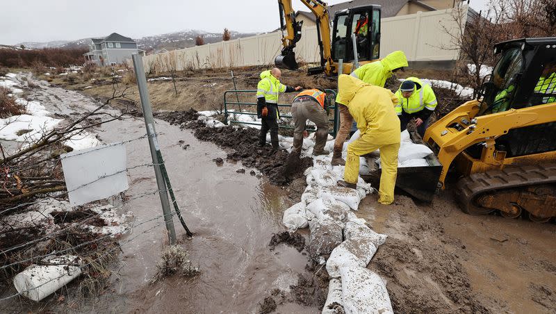 City employees fill sand bags due to flooding in Highland on March 15.
